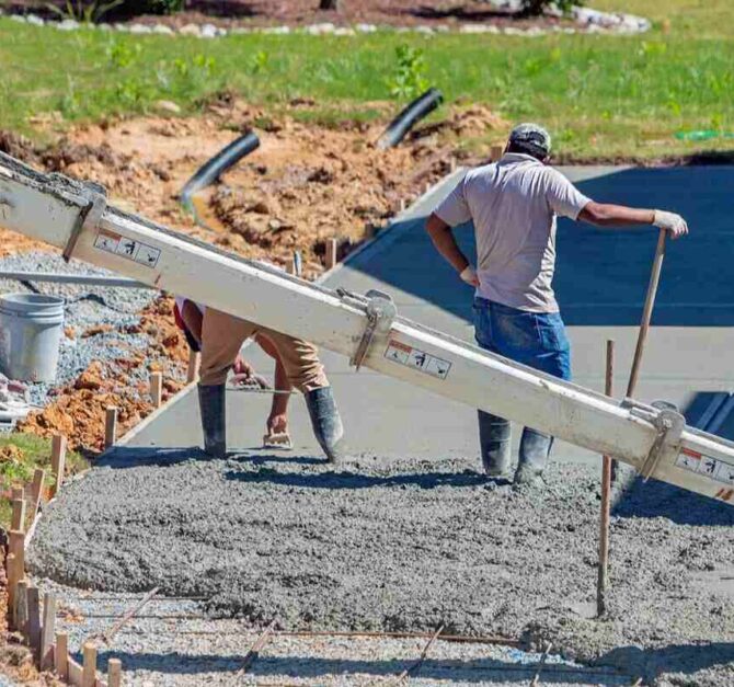 men-working-on-a-new-concrete-driveway-at-a-residential-home